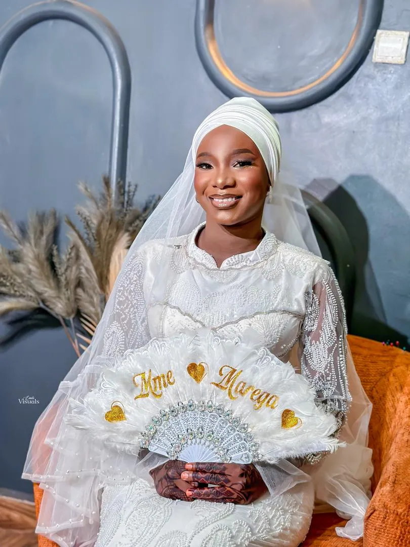 Bride with a personalized wedding fan