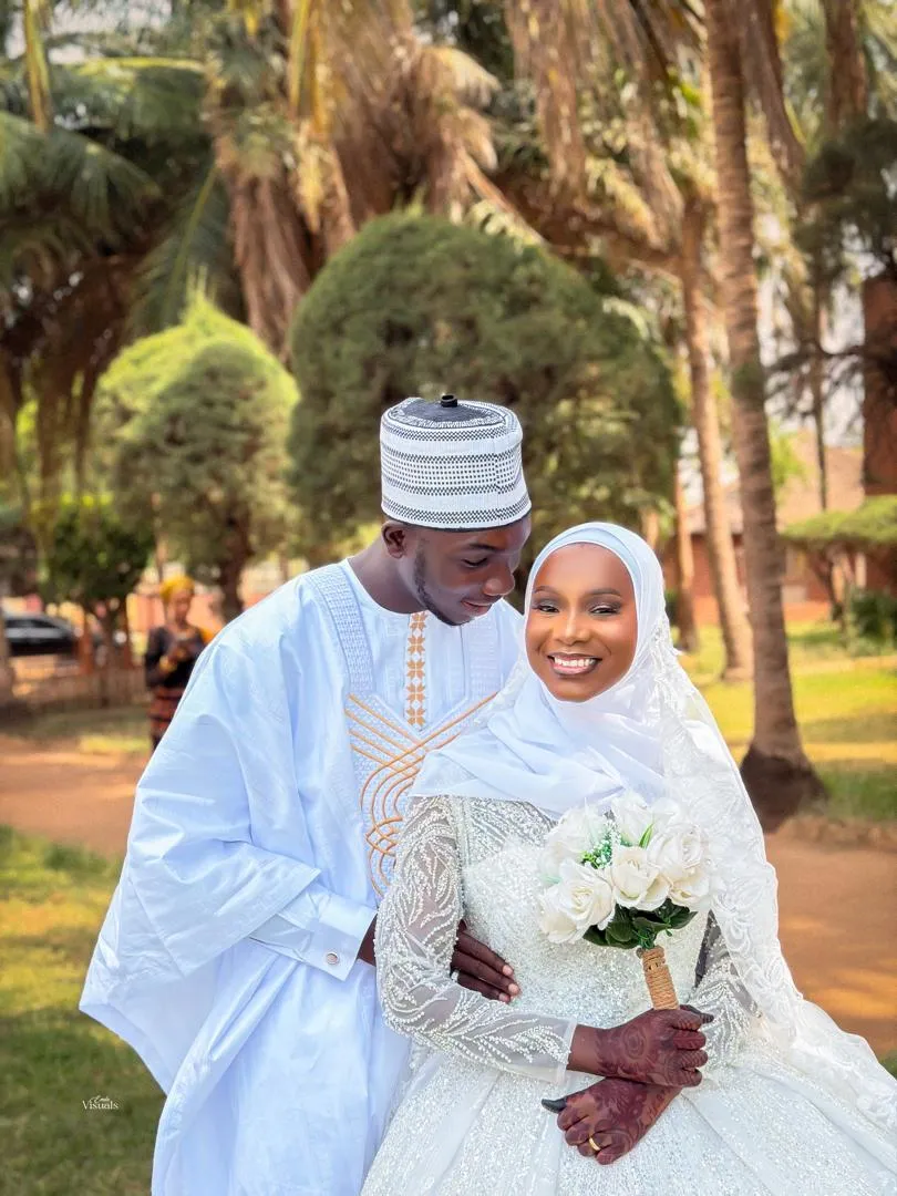 Newlyweds smiling in the garden